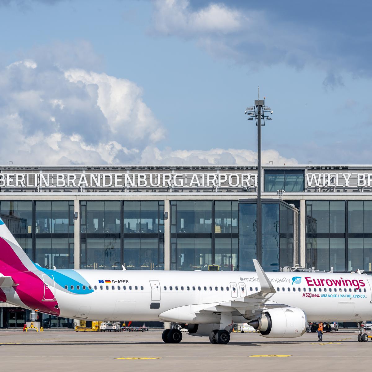 Eurowings aircraft on the apron of Terminal 1 at Berlin Brandenburg Airport.