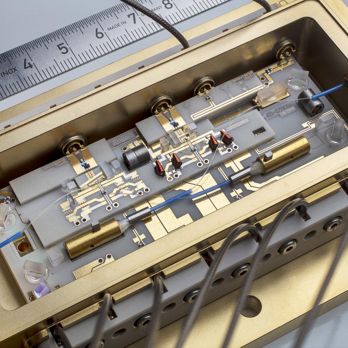 Photo of a micro-integrated laser module with an optical semiconductor amplifier for quantum sensing experiments in space.