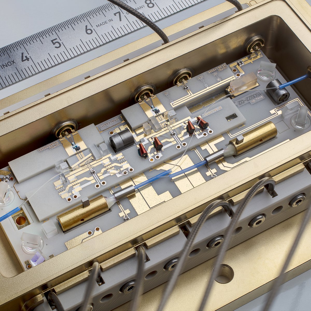 Image of a micro-integrated laser module with an optical semiconductor amplifier for quantum sensing experiments in space.