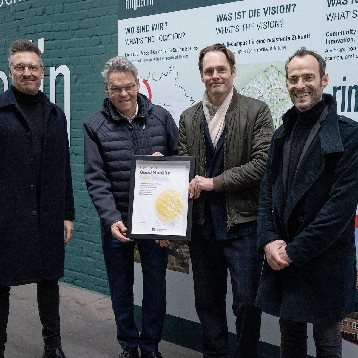Ceremonial Presentation of the Pre-Certified Good Mobility Gold for Hall 2 at the Model Campus. Pictured from left to right: Christian Scheler, Founder and CEO of Good Mobility Council, Jörn Oltmann, District Mayor of Tempelhof-Schöneberg, Matthias Menger, Managing Director of ringberlin, Dr. Ingo Kucz, Managing Director of Good Mobility Council.
