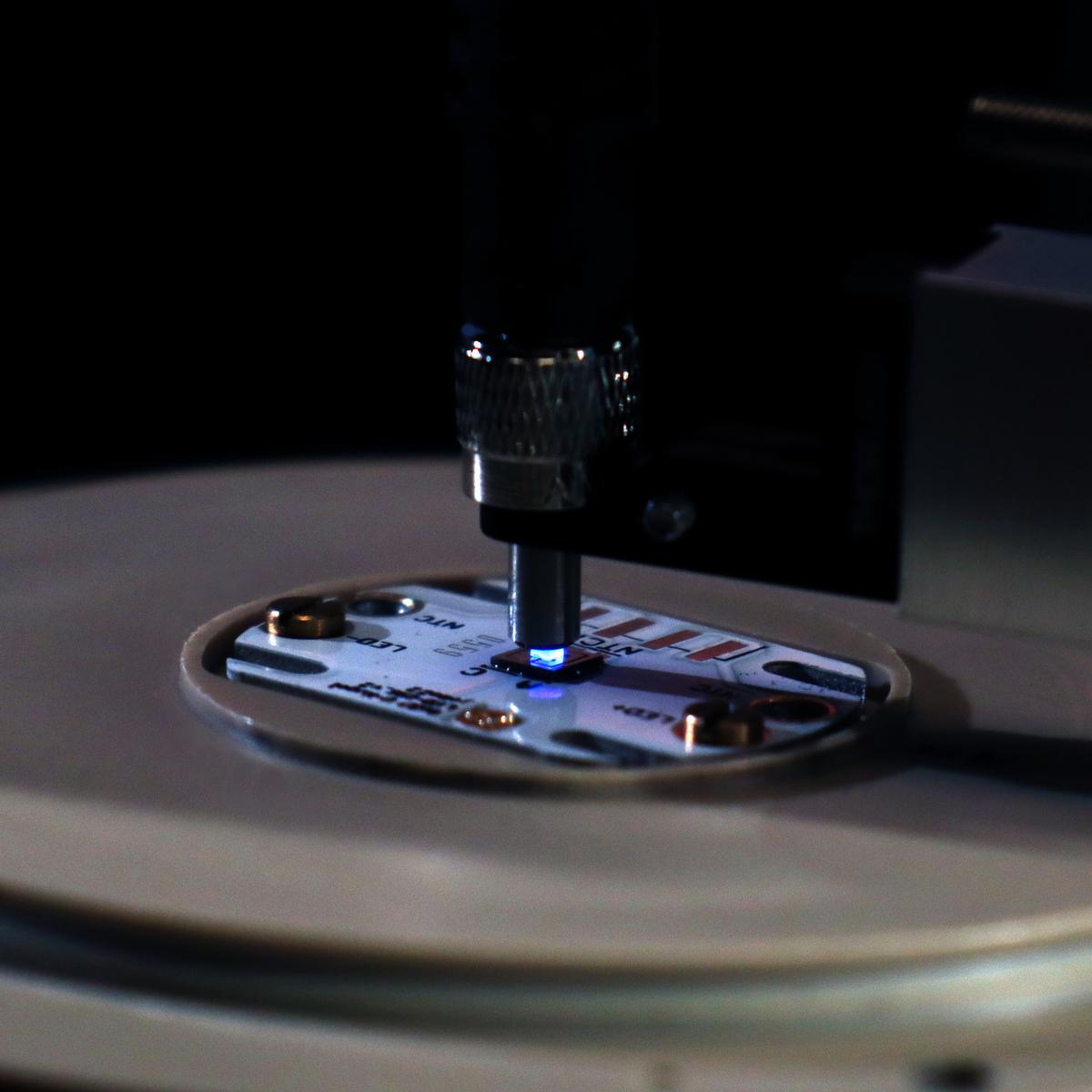Laboratory setup with far-UVC LED chip consisting of tens of thousands of 235 nm micro-LEDs emitting into a glass fiber.