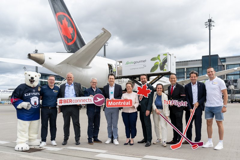In the photo (from left to right): Bully, the Eisbären Berlin mascot; Thomas Bothstede (Managing Director of Eisbären Berlin); Jens Warnken (President of the Cottbus Chamber of Industry and Commerce); Jean Christophe Herault (Country Sales Manager for Germany, Switzerland and Austria, Air Canada); Aletta von Massenbach (CEO, Flughafen Berlin Brandenburg GmbH); Robert Rückel (Vice-President of the Berlin Chamber of Commerce and Industry), Geneviève Rolland (Chief Representative of Québec in Germany, Austria and Switzerland), Rocky Lo (Managing Director of International Sales at Air Canada), Thomas Kohr (Head of Corporate & Business Development at Flughafen Berlin Brandenburg GmbH) and Yannick Veilleux (Eisbären Berlin player from Montréal)