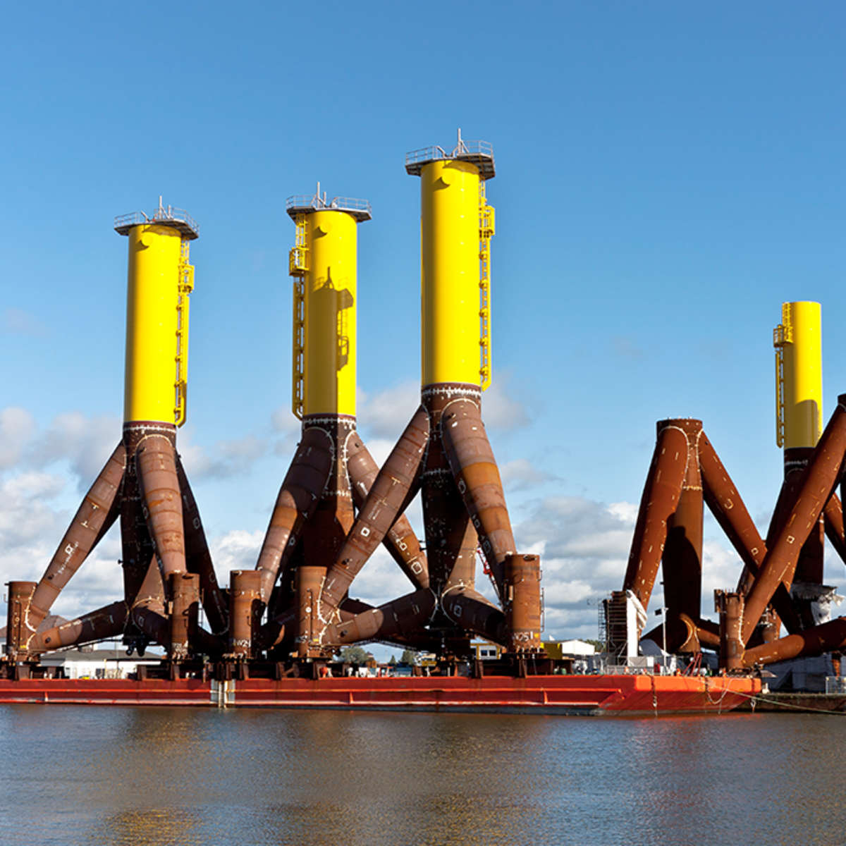 The picture shows large steel towers of a wind turbine. They are 120 meters high.