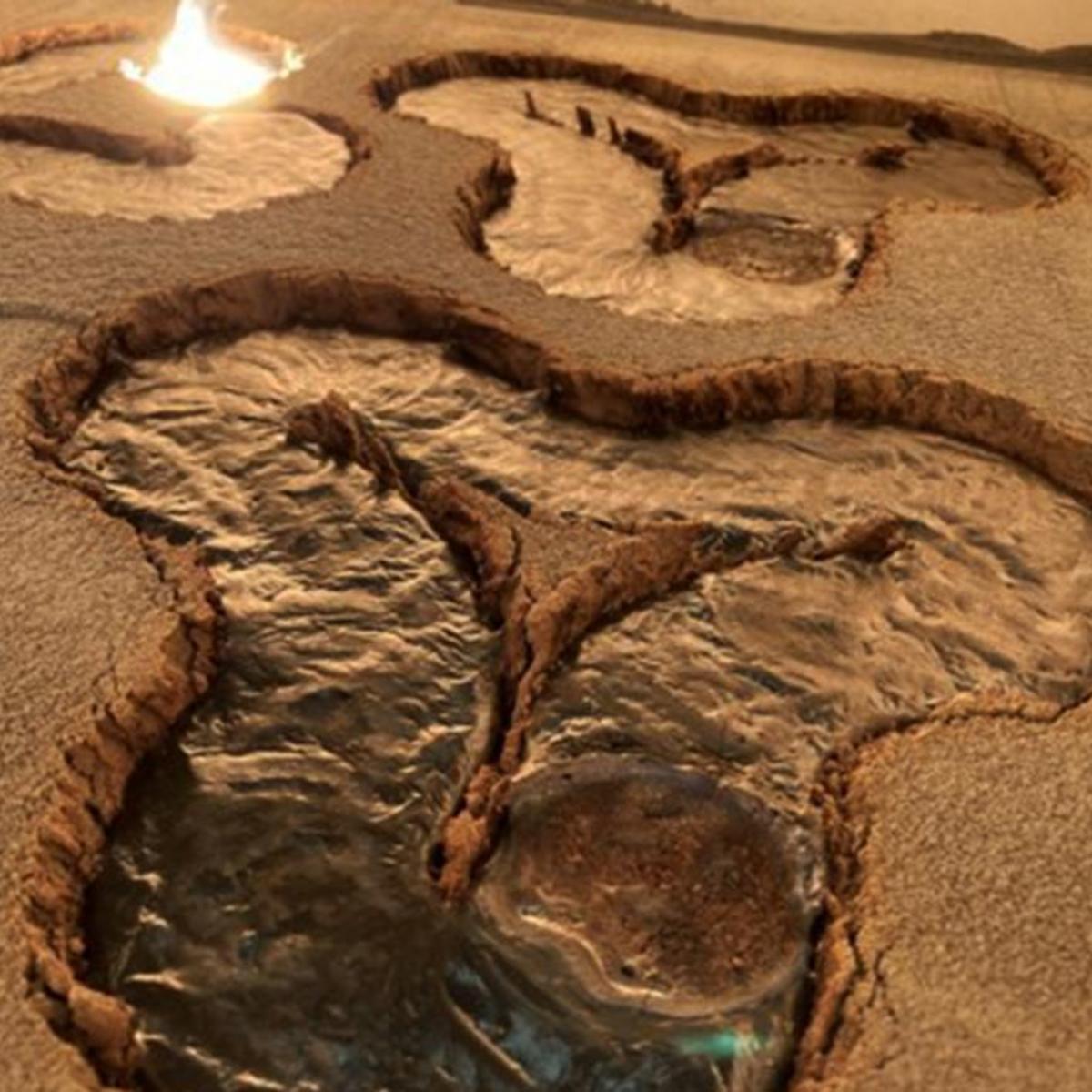The image shows 3D printed landing surfaces on the moon. The photo shows the difference between the texture of lunar dust and the same dust transformed into a solid, smooth surface by additive manufacturing.