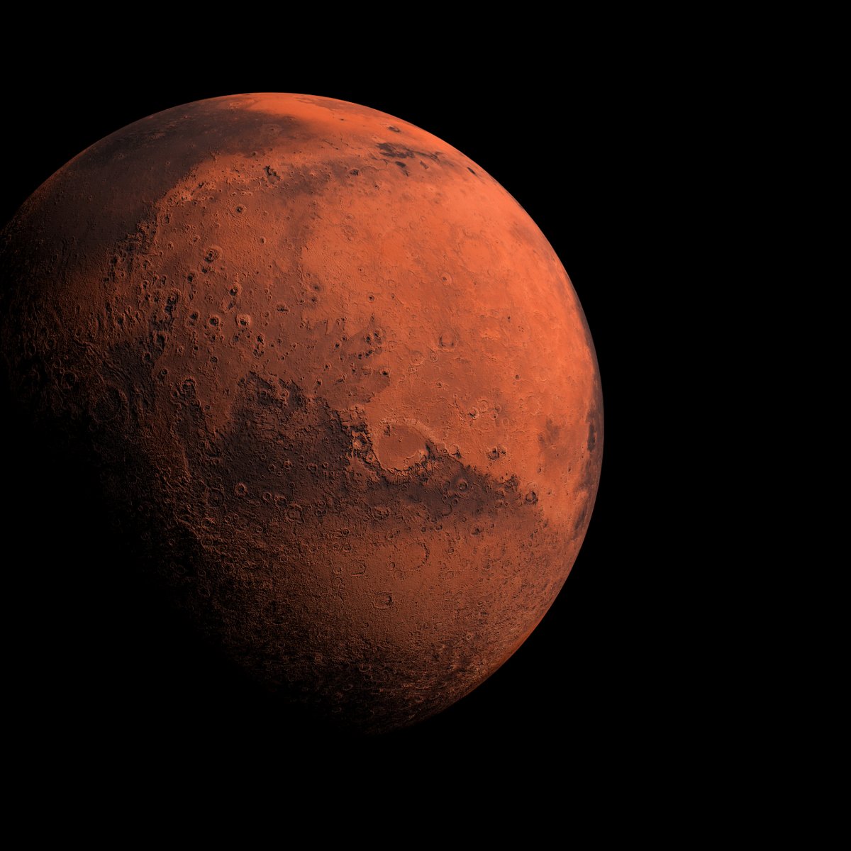 Image of the Red Planet Mars, partially in shadow.