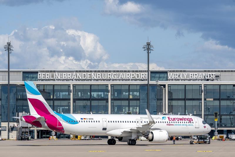 Eurowings aircraft in front of the BER terminal on the apron