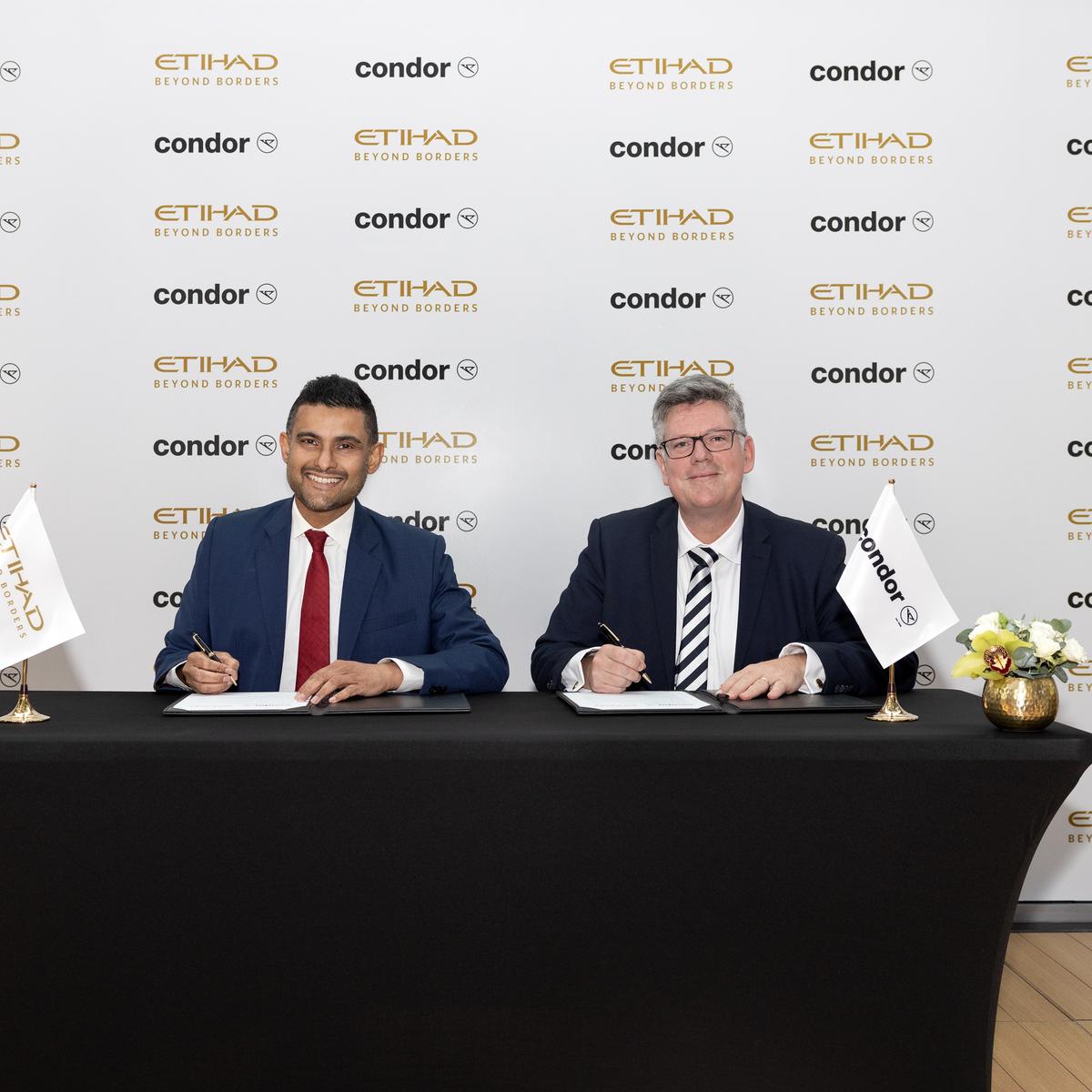 At the signing of the codeshare agreement, the following individuals are at the table: Arik De, Chief Revenue and Commercial Officer, Etihad Airways | Jens Boyd, Commercial Director and Member of the Executive Committee, Condor