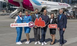 The following people are standing in front of the Eurowings aircraft: Stefan Nitert, Station Manager Eurowings (3rd from right), Katy Krüger, Head of Terminal Management, Flughafen Berlin Brandenburg GmbH (2nd from right), Andreas Ley, Business Development Aviation Officer, Flughafen Berlin Brandenburg GmbH (1st from right) and Eurowings crew are looking forward to the first flight to the coastal city on the Bay of Kotor.