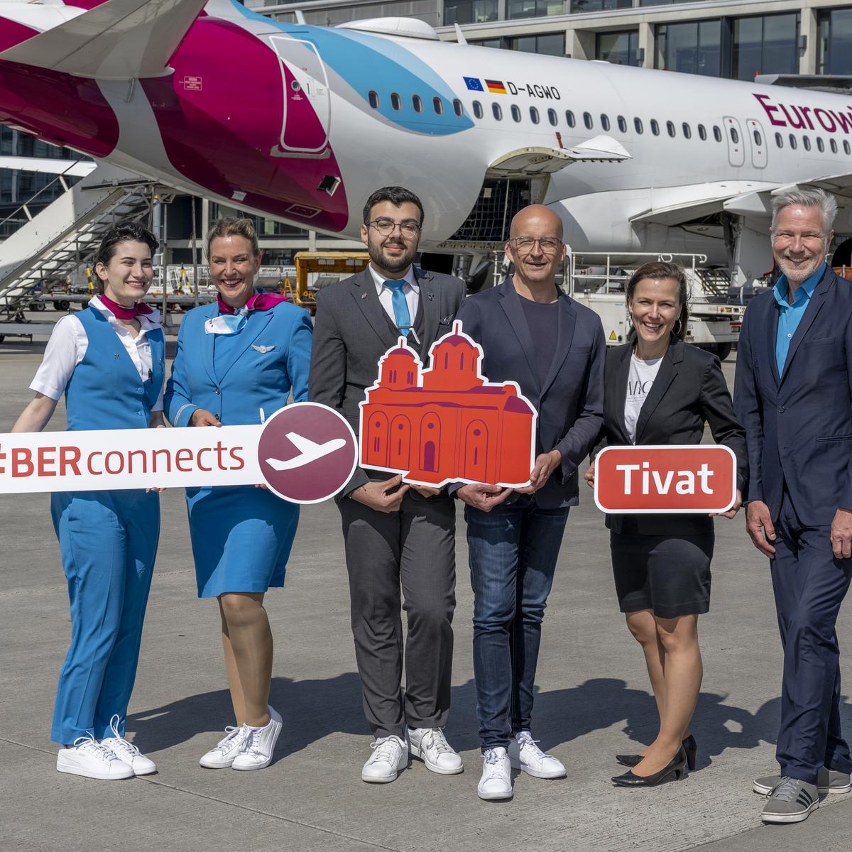 The following people are standing in front of the Eurowings aircraft: Stefan Nitert, Station Manager Eurowings (3rd from right), Katy Krüger, Head of Terminal Management, Flughafen Berlin Brandenburg GmbH (2nd from right), Andreas Ley, Business Development Aviation Officer, Flughafen Berlin Brandenburg GmbH (1st from right) and Eurowings crew are looking forward to the first flight to the coastal city on the Bay of Kotor.