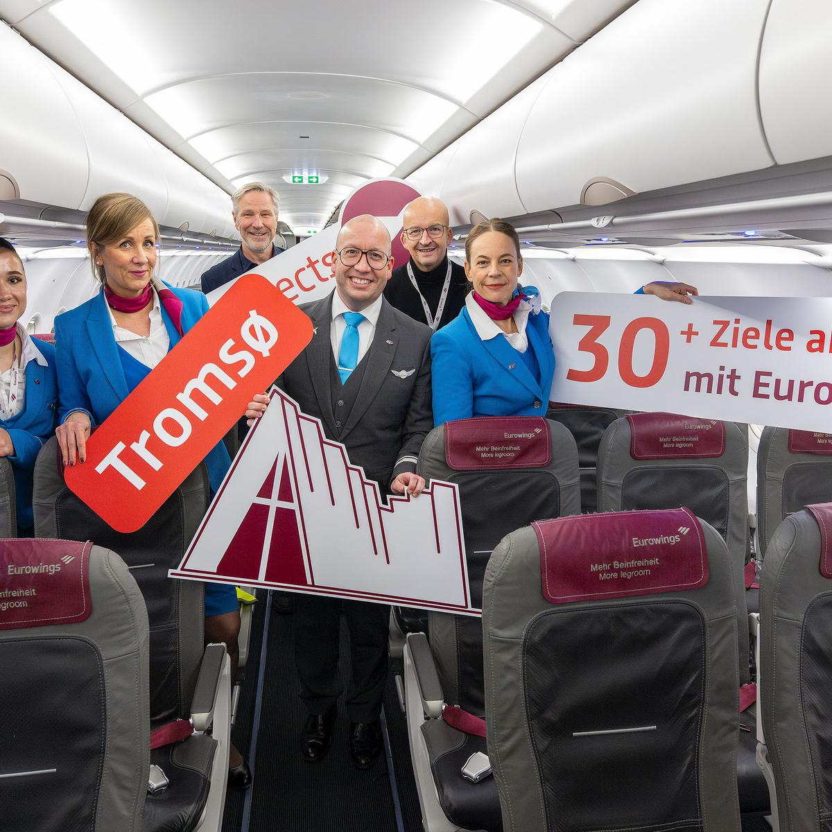 Eurowings is further expanding its offer of flights from BER. In the picture: Andreas Ley, Senior Manager Aviation Marketing, Flughafen Berlin Brandenburg GmbH (1st from left) and Eurowings crew.